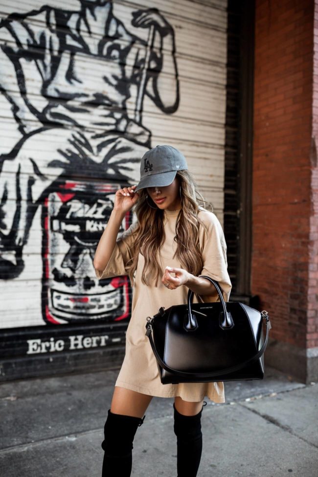 fashion blogger mia mia mine wearing a t shirt dress and over the knee boots from the nsale 2019