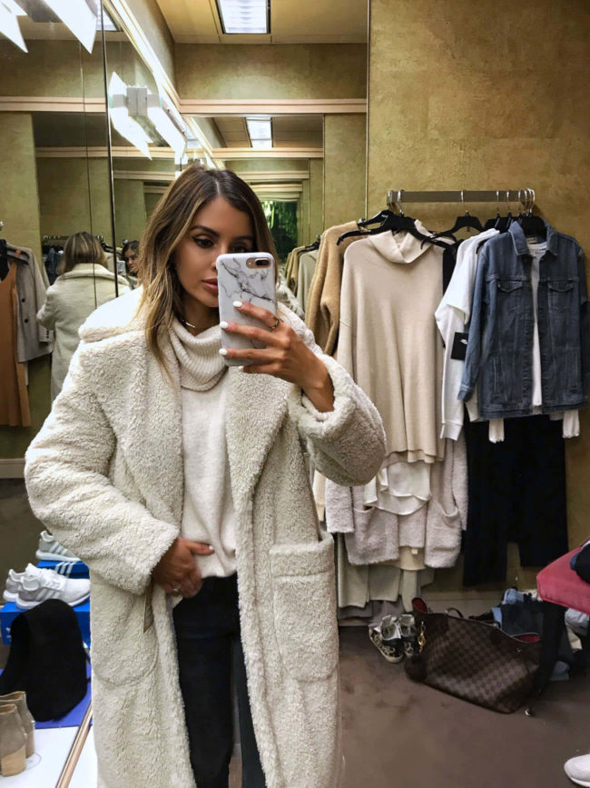 fashion blogger mia mia mine wearing a chunky knit sweater from the nordstrom anniversary sale 2019