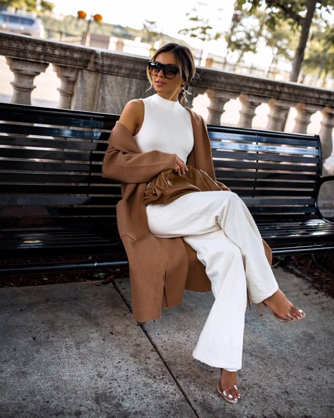 fashion blogger mia mia mine wearing a camel sweater coat from mango and a bottega veneta the pouch bag in camel