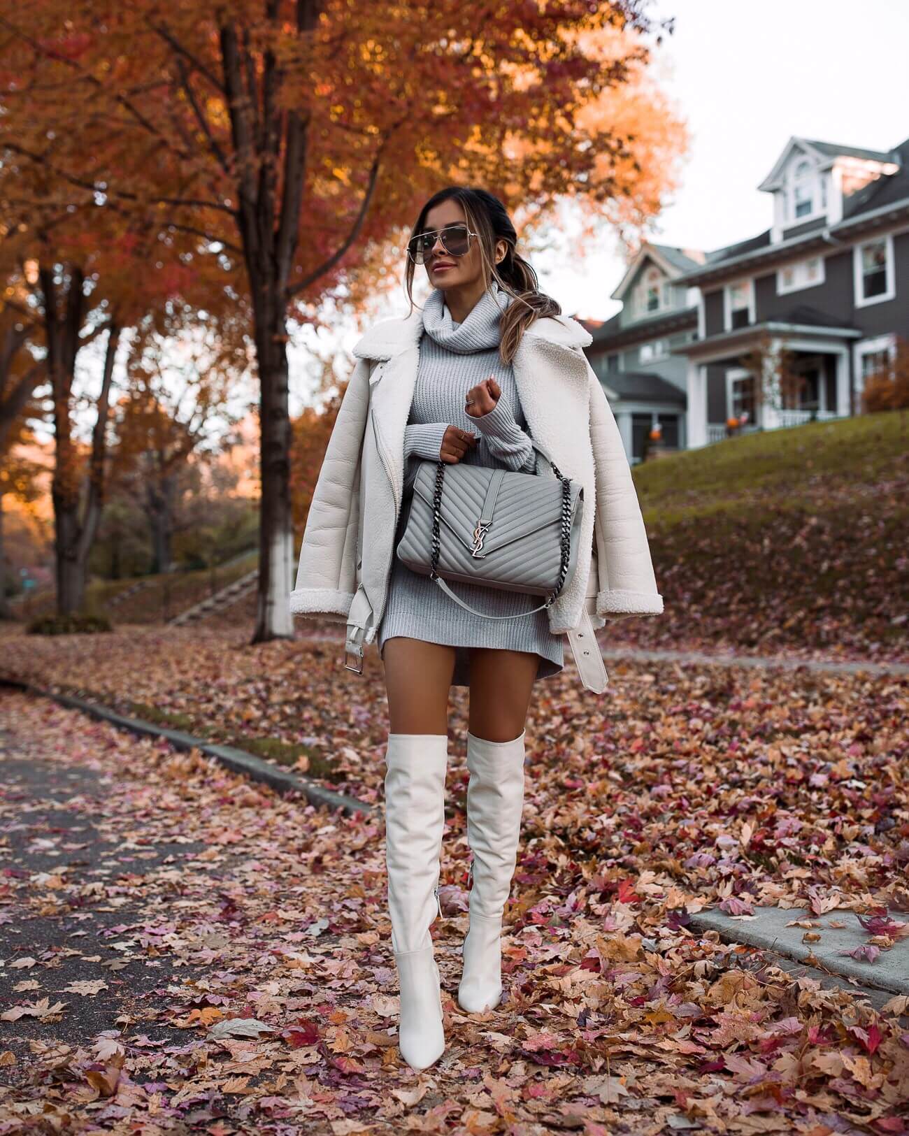 fashion blogger mia mia mine wearing a gray sweater dress from revolve