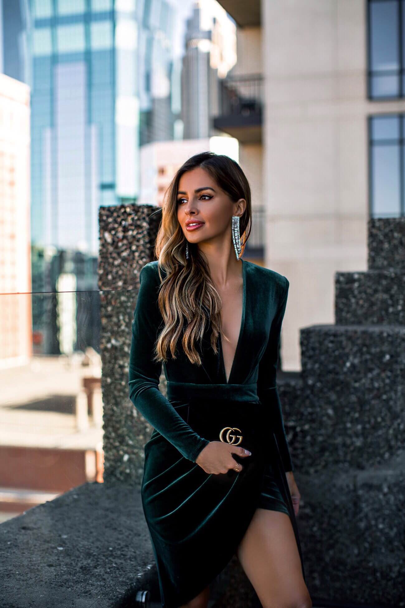 fashion blogger mia mia mine wearing a velvet dress and gucci bag at hotel ivy minneapolis