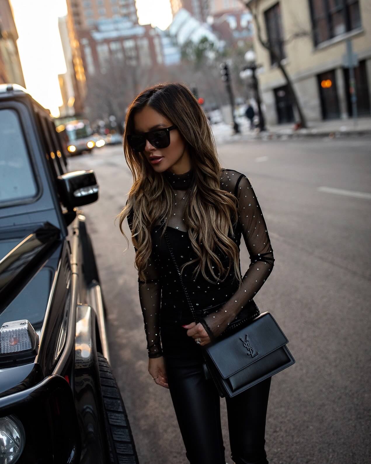 fashion blogger mia mia mine wearing a studded bodysuit from revolve
