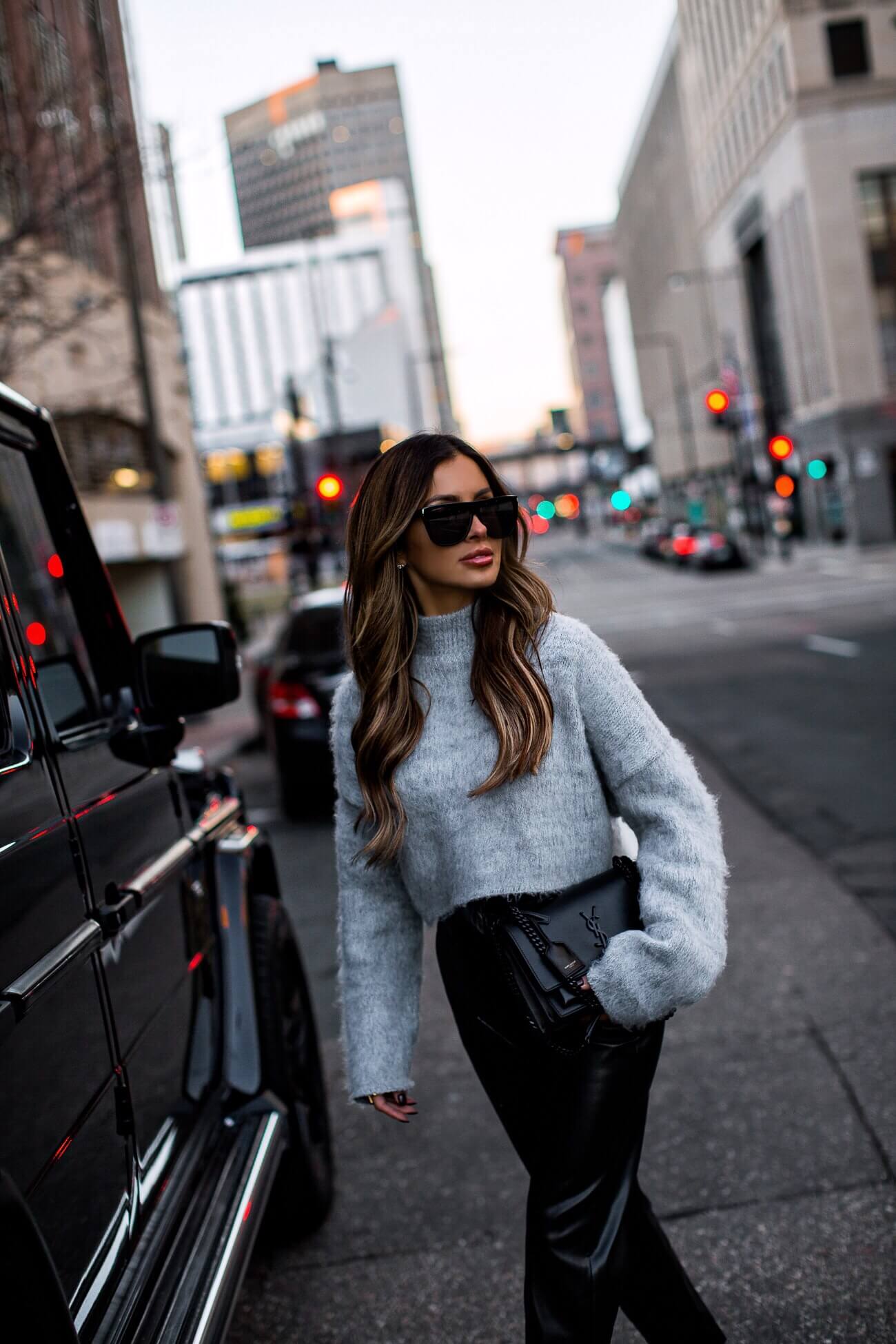 fashion blogger mia mia mine wearing faux leather trousers from express