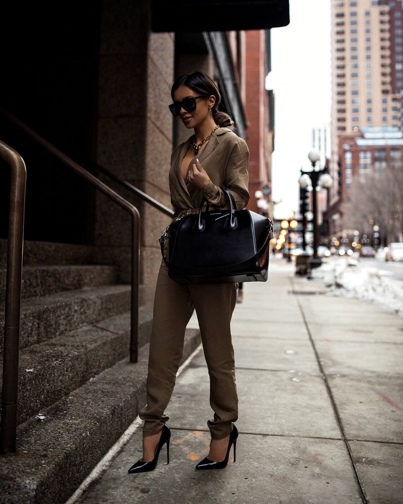 fashion blogger mia mia mine wearing a revolve jumpsuit