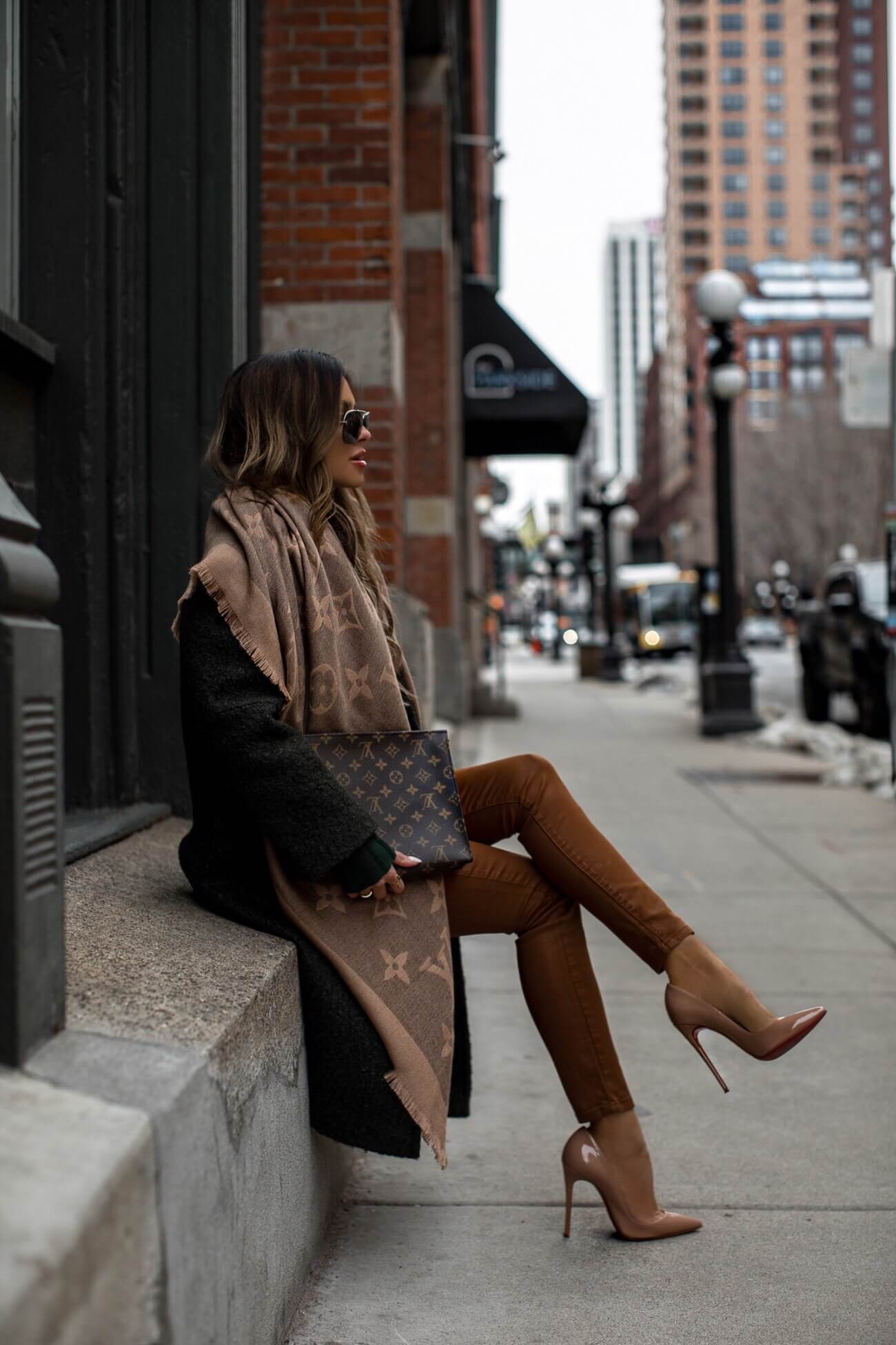 fashion blogger mia mia mine wearing a green coat and a louis vuitton scarf for winter
