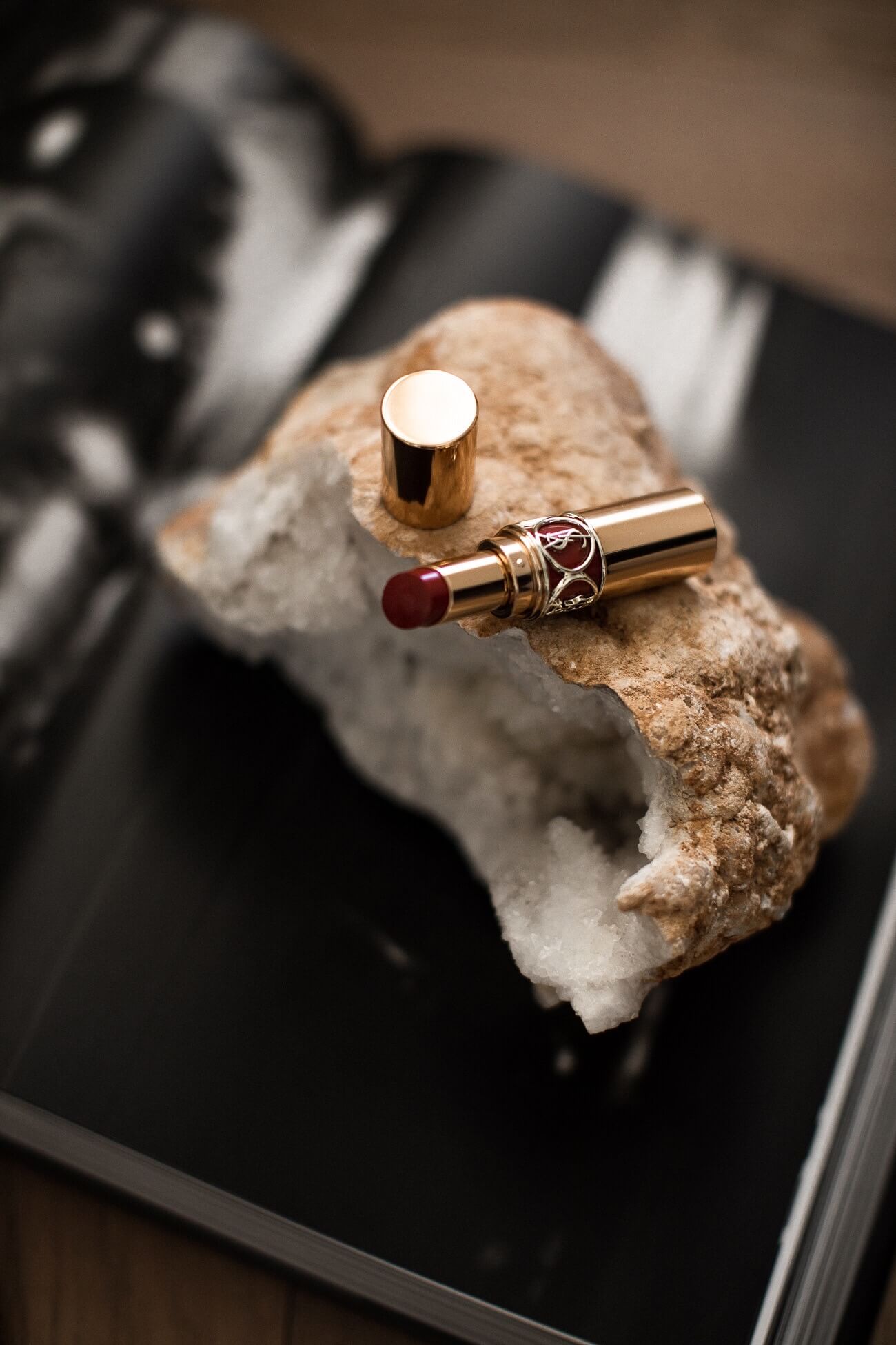 ysl lipstick displayed on a geode
