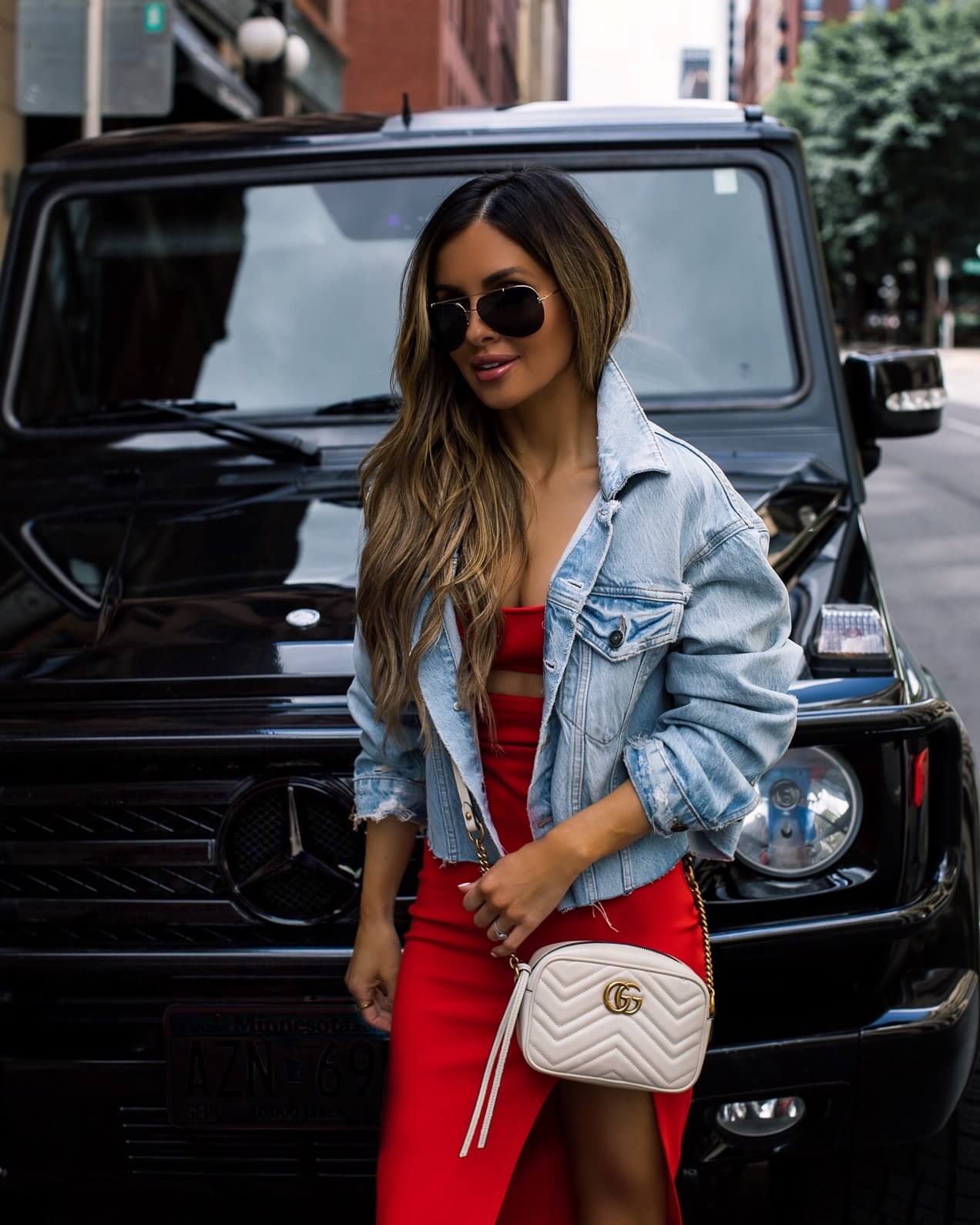 Fashion blogger mia mia mine wearing a red dress from revolve