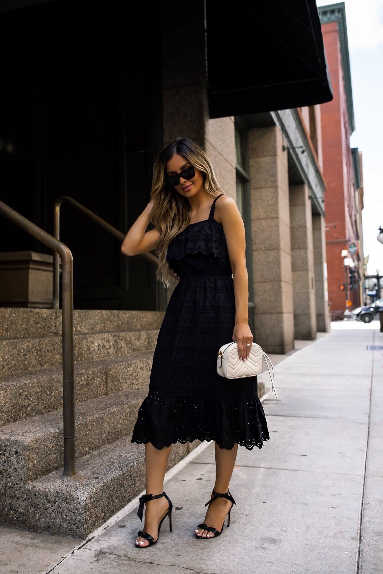 fashion blogger mia mia mine wearing a black dress from walmart and black heels