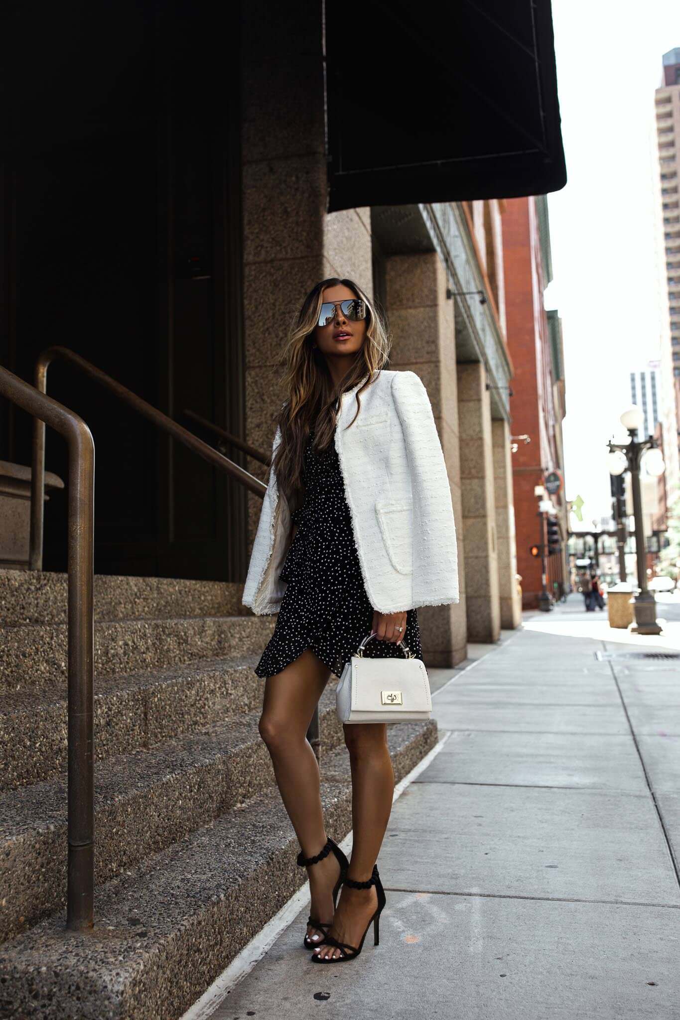 fashion blogger wearing a summer black and white outfit