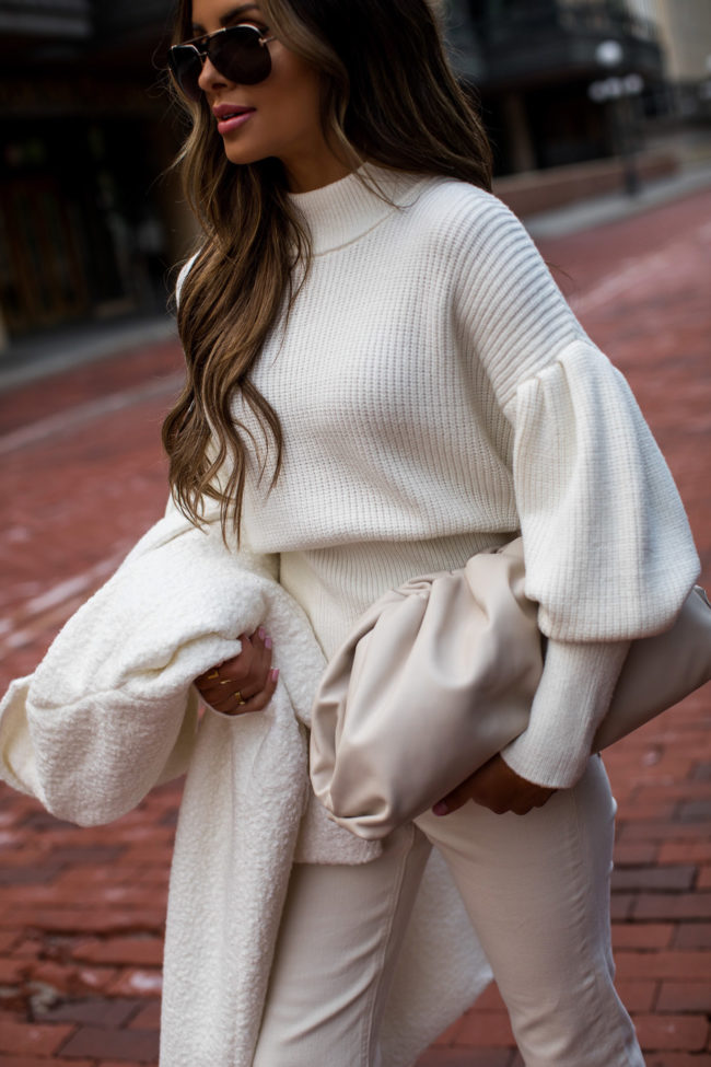 mia mia mine wearing a statement sweater from express for fall