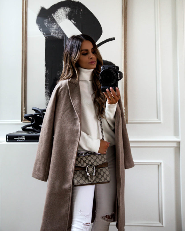 fashion blogger mia mia mine wearing a white sweater and white abercrombie denim