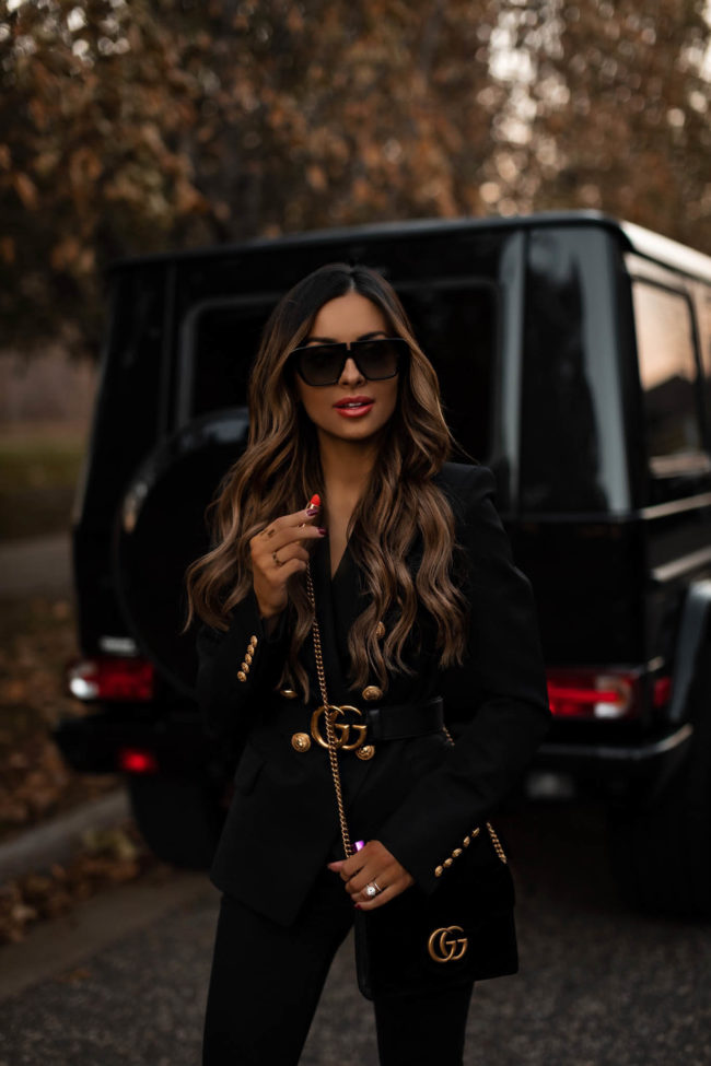 fashion blogger mia mia mine wearing a gucci belt and gucci lipstick