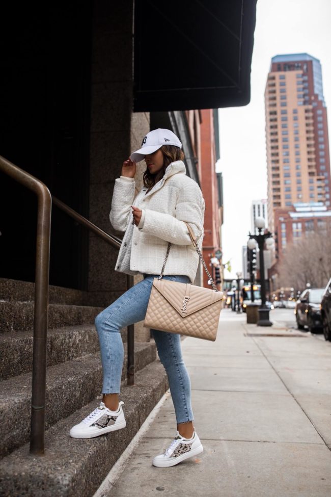 mia mia mine wearing a boucle jacket from express and white sneakers