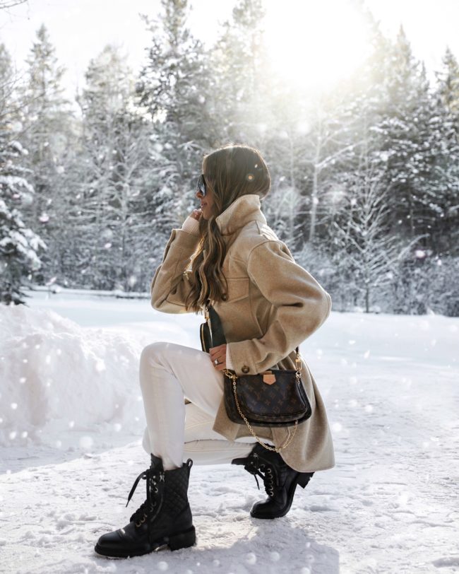 fashion blogger mia mia mine wearing a beige shacket from zara in jackson hole