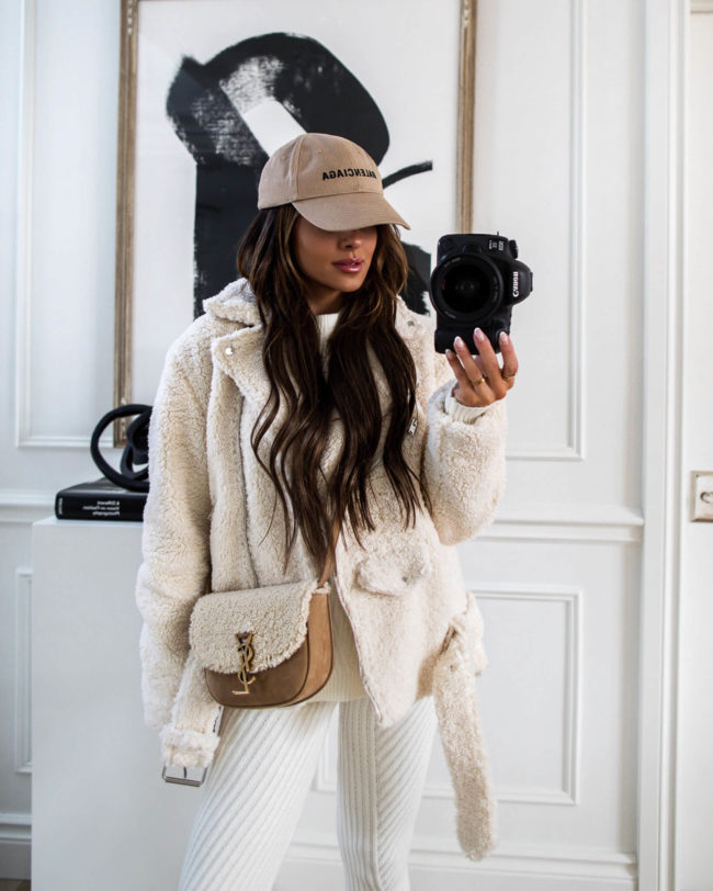 mia mia mine wearing a white sherpa jacket from forever 21