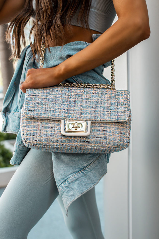 mia mia mine wearing a karl lagerfeld bag from saks off 5th