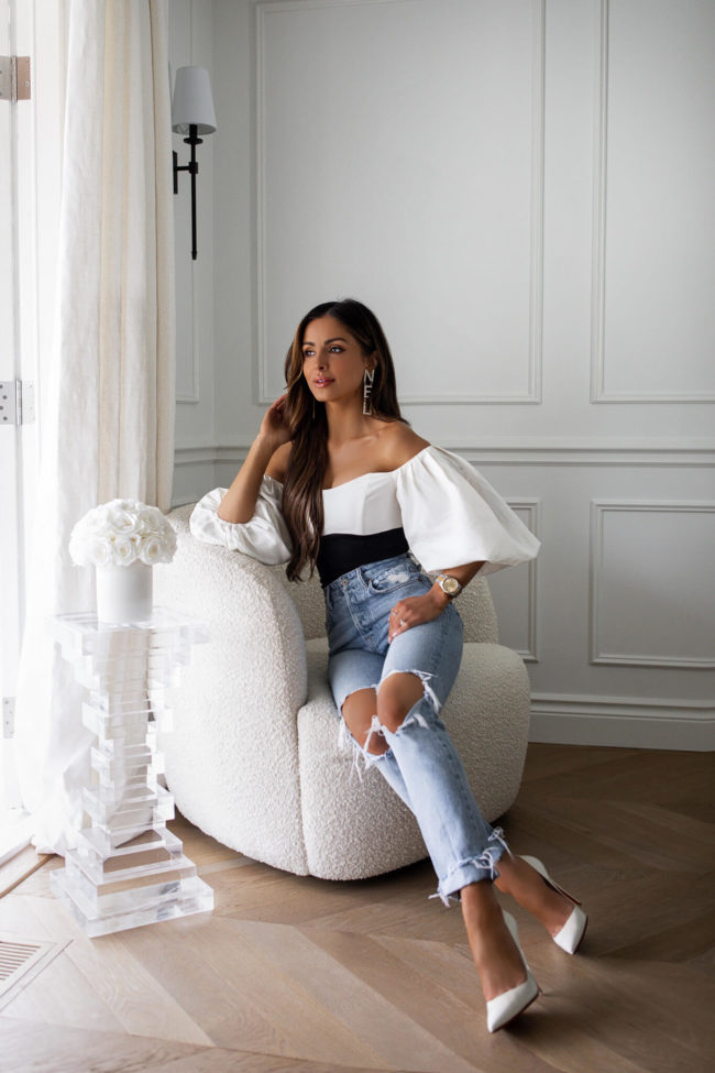 fashion blogger at home wearing denim and an off the shoulder bodysuit from nordstrom