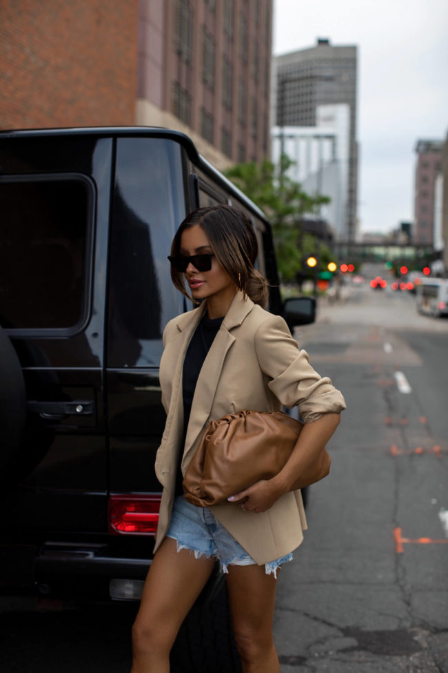 fashion blogger mia mia mine wearing a bottega veneta the pouch bag
