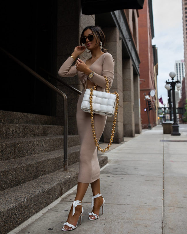 fashion blogger mia mia mine wearing a pink knit dress from revolve