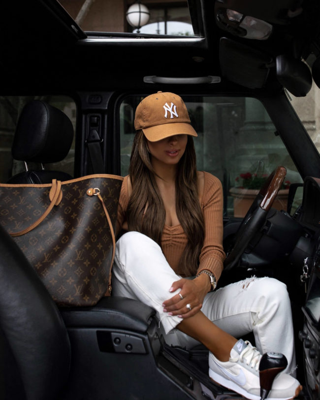 fashion blogger mia mia mine with a louis vuitton neverfull gm