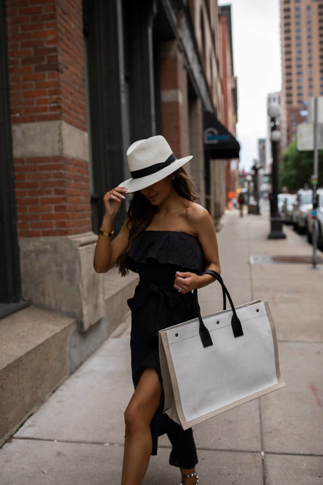 fashion blogger mia mia mine wearing a black strapless dress by sofia jeans at walmart