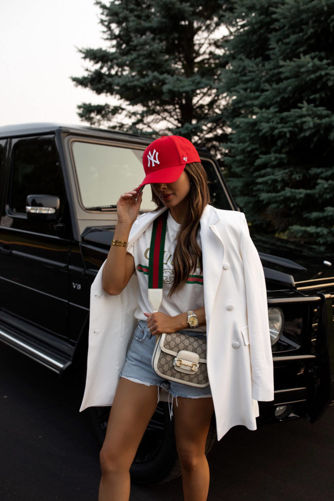 fashion blogger wearing a white gucci horsebit 1955 crossbody bag