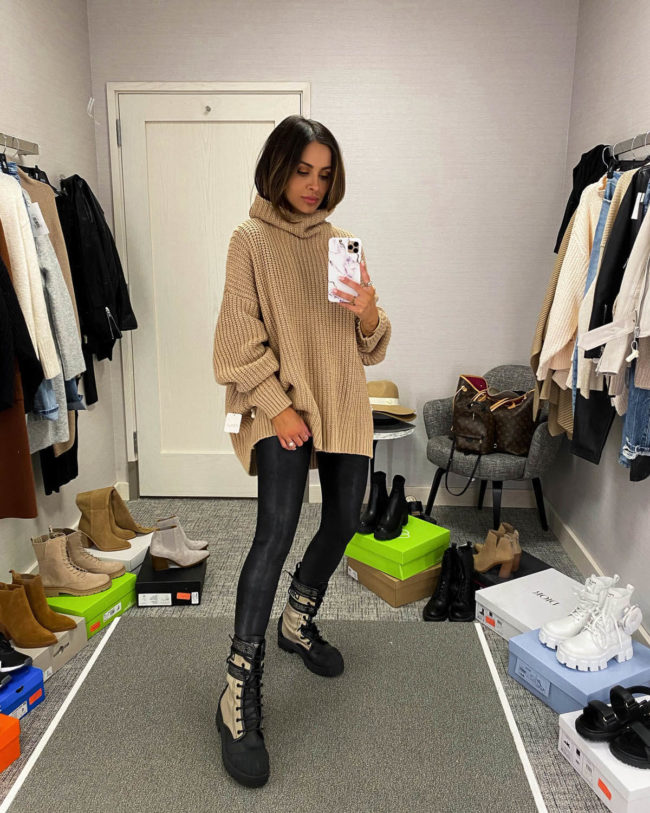 brunette fashion blogger wearing a camel free people chunky knit sweater from the nsale
