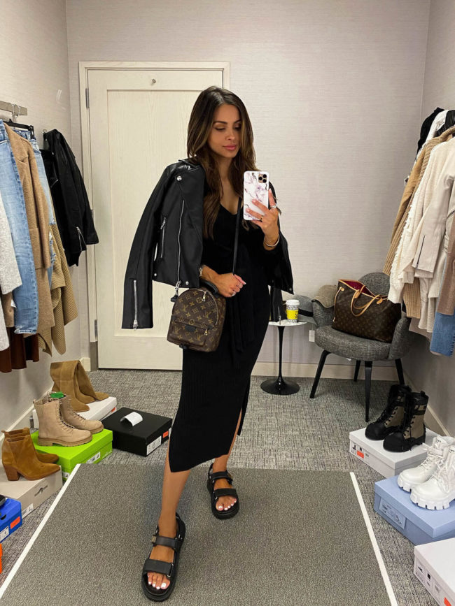 fashion blogger mia mia mine wearing a faux leather jacket and black knit midi dress from the nordstrom anniversary sale