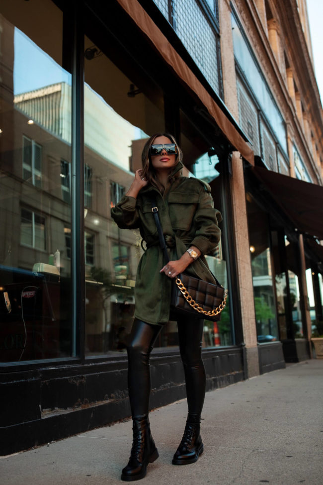fashion blogger mia mia mine wearing faux leather leggings and black combat boots from walmart