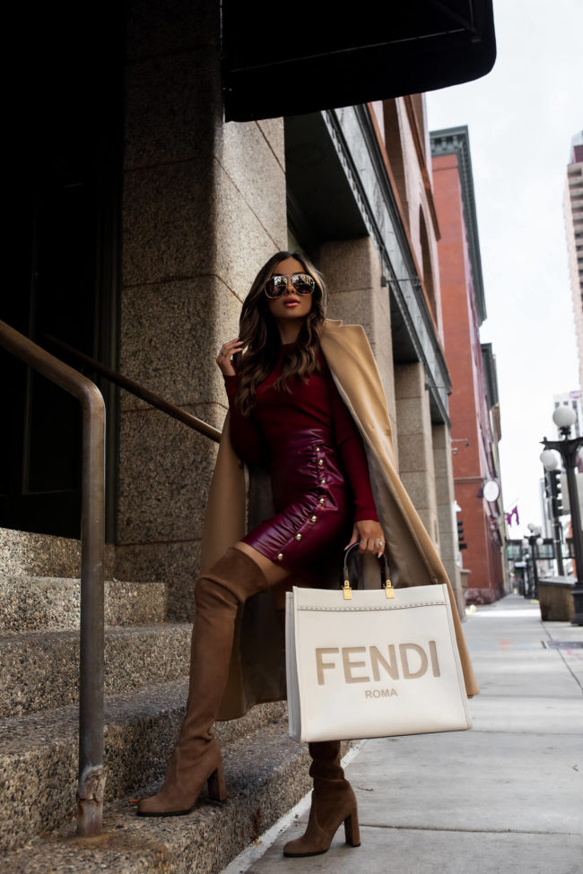 fashion blogger wearing a burgundy faux leather dress from karen millen