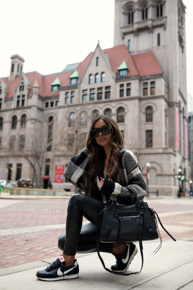fashion blogger wearing nike daybreak black sneakers