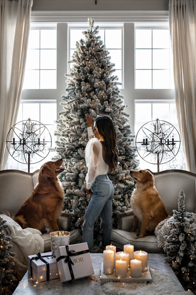 mia mia mine with golden retrievers around the christmas tree