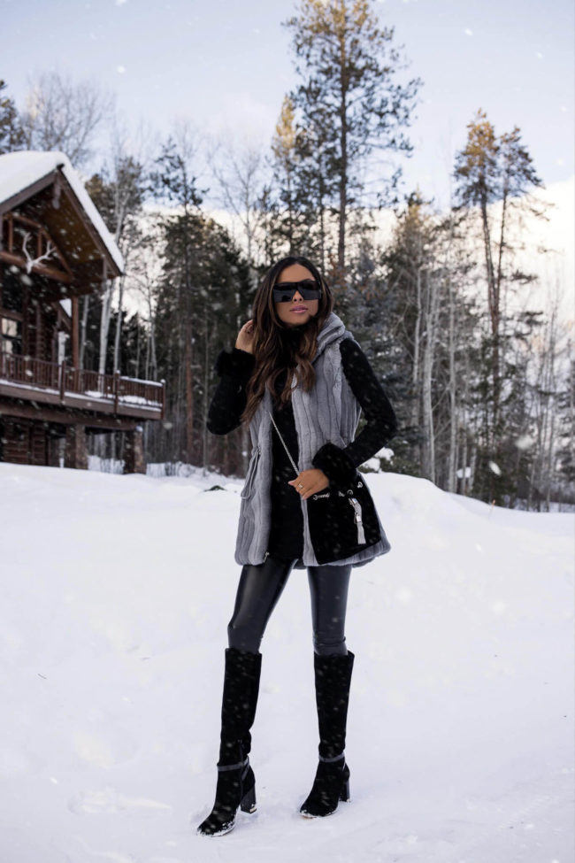 mia mia mine wearing suede boots from whbm and a faux fur vest