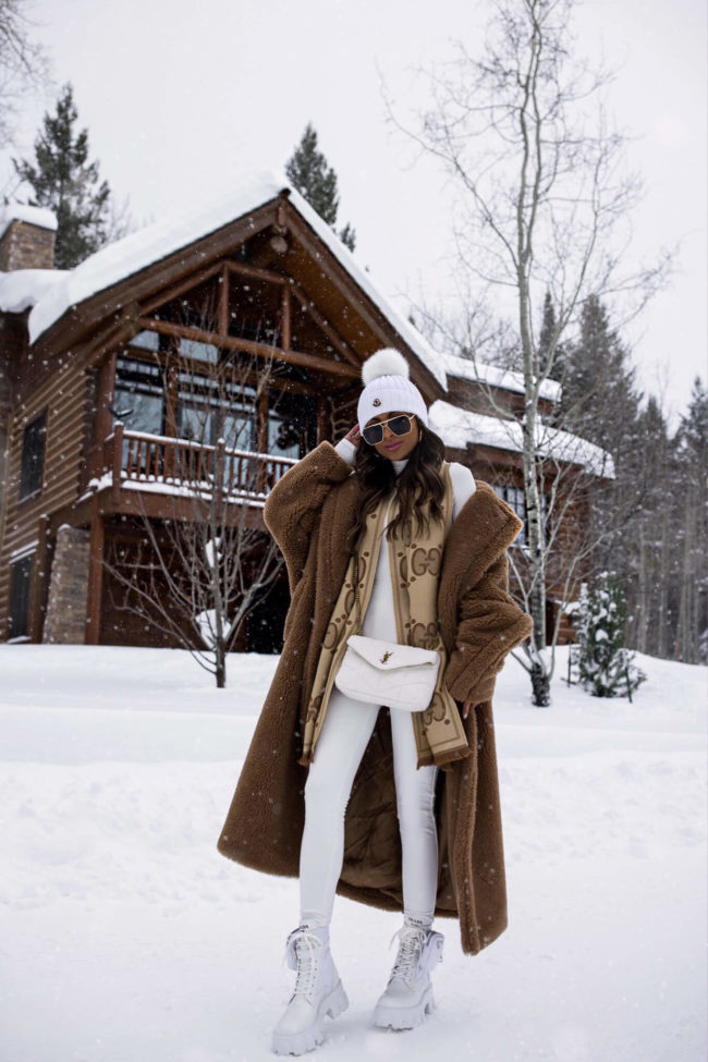 mia mia mine wearing a max mara teddy bear coat and white prada boots