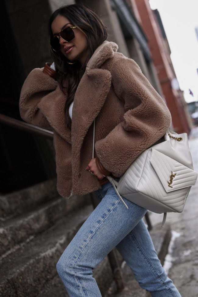 fashion blogger wearing a white saint laurent backpack from nordstrom