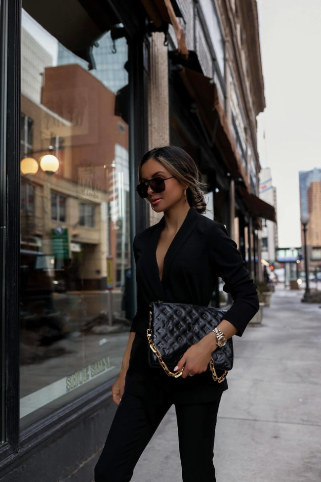 fashion blogger mia mia mine wearing a louis vuitton coussin bag