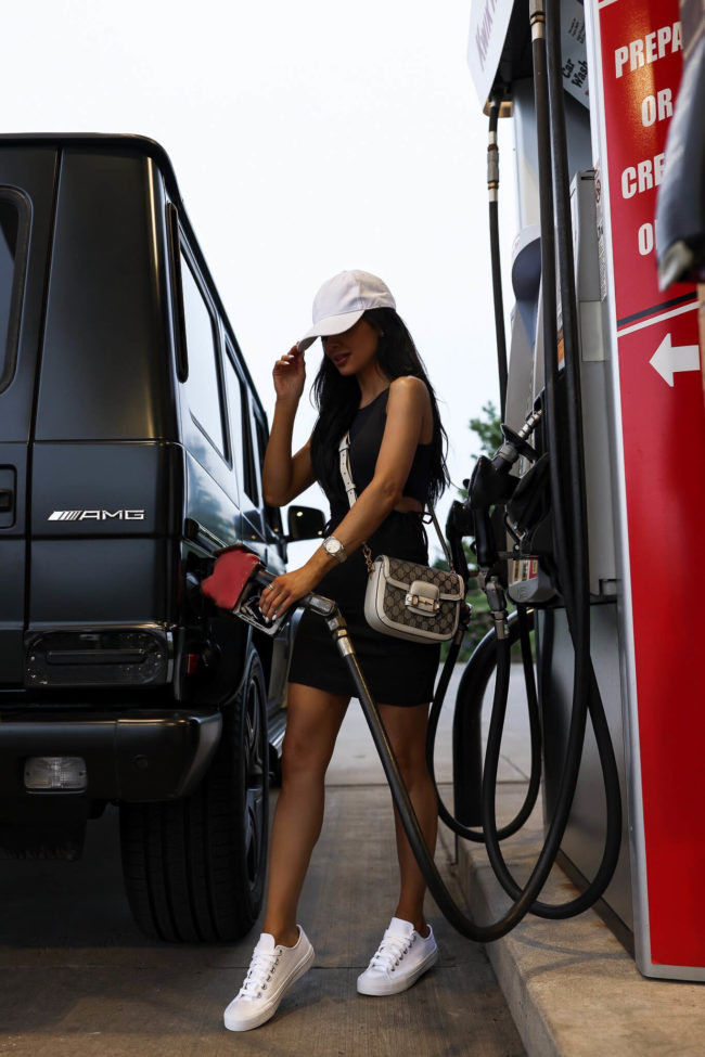fashion blogger mia mia mine wearing a dress from walmart pumping fuel with a walmart + discount