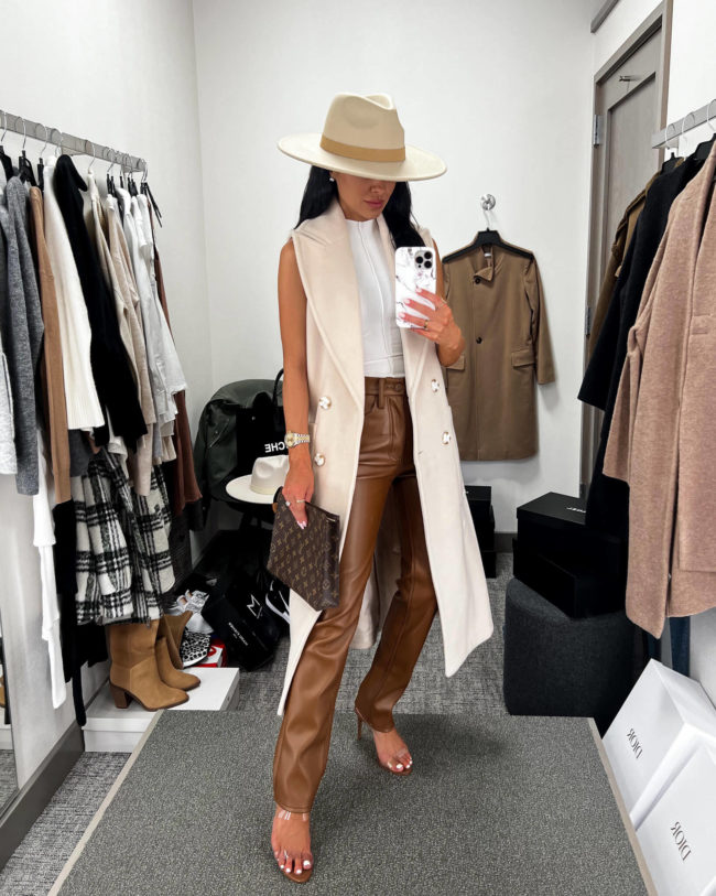 fashion blogger mia mia mine wearing brown faux leather pants from the nsale 2022
