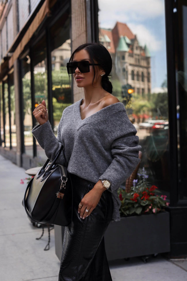 mia mia mine wearing a gray cashmere sweater and leather skirt from the nordstrom anniversary sale 2022