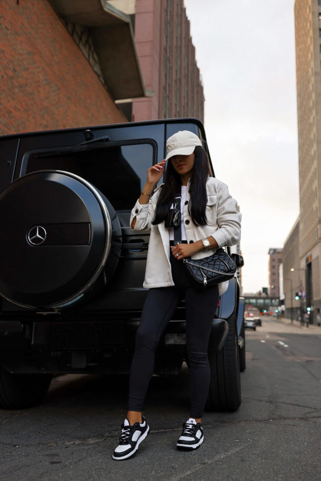 fashion blogger mia mia mine wearing a white shacket from walmart