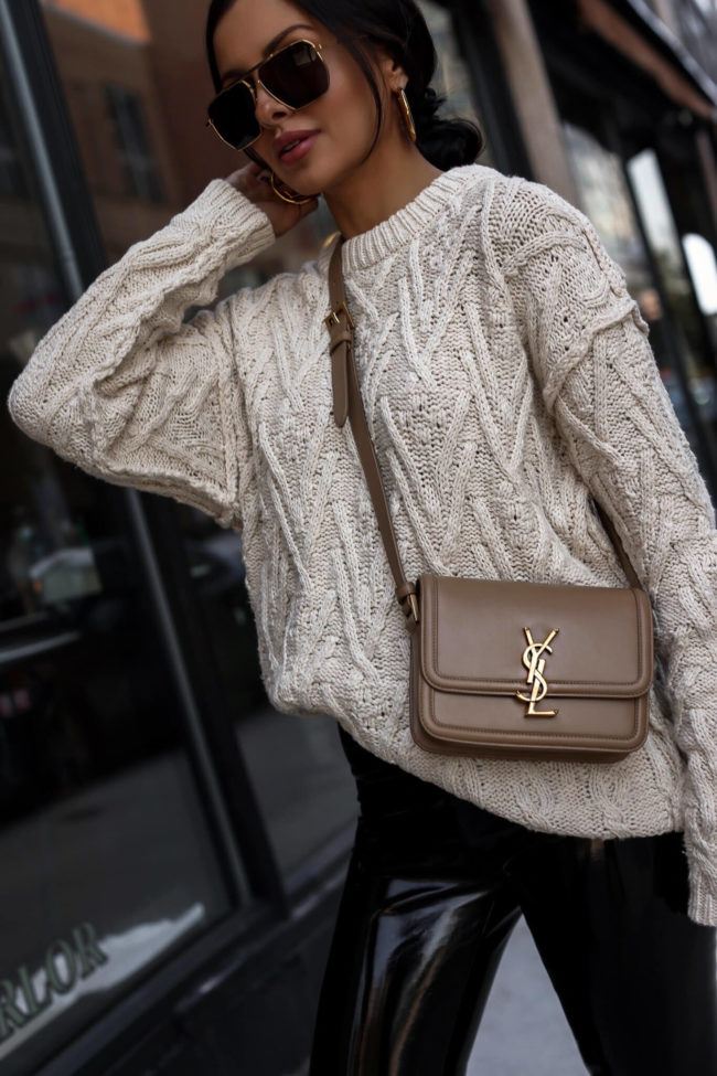 fashion blogger mia mia mine wearing a crossbody saint laurent bag