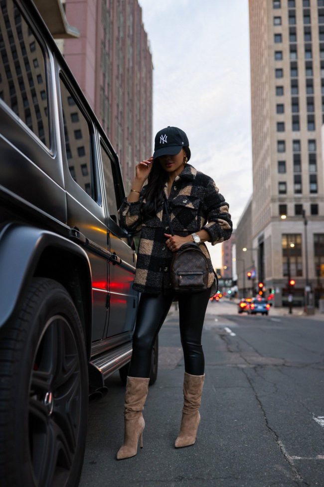 fashion blogger wearing a plaid shacket and faux leather pants from abercrombie