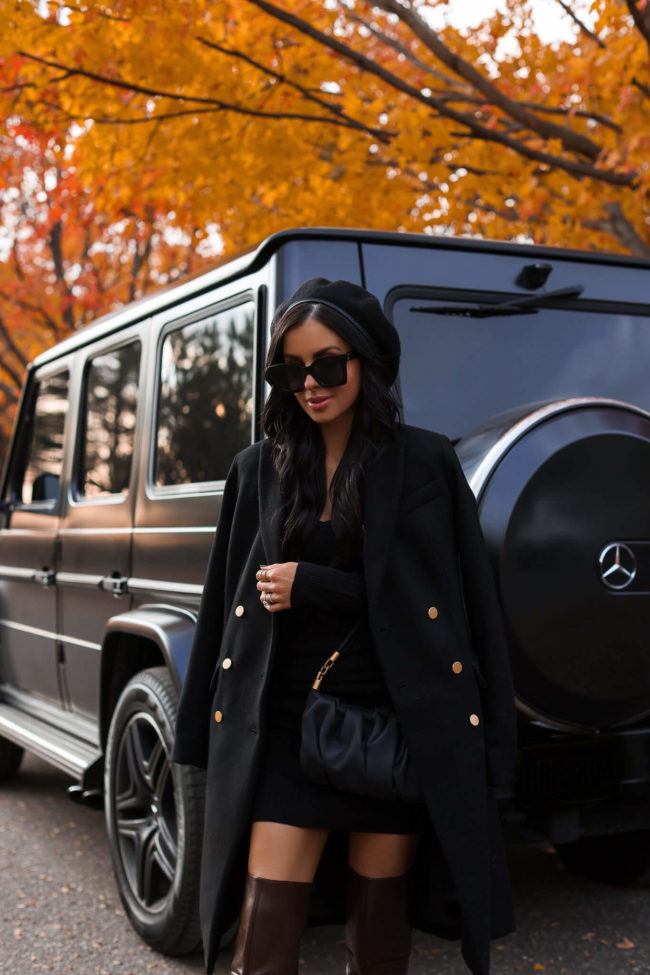 fashion blogger mia mia mine wearing a black wool coat from walmart