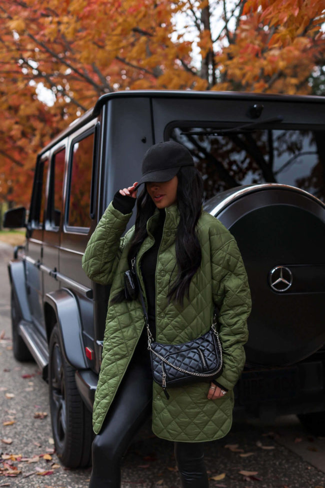 fashion blogger mia mia mine wearing a green quilted jacket from walmart