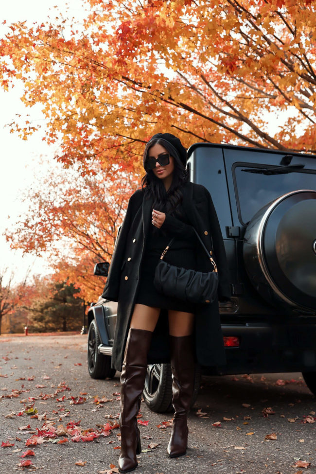 fashion blogger mia mia mine wearing a black and gold button coat for fall from walmart