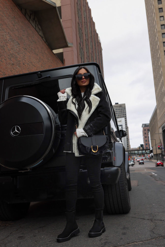 fashion blogger mia mia mine wearing a sherpa moto jacket from walmart