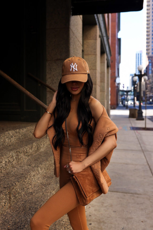 fashion blogger wearing a camel sweatshirt and work outfit from puma