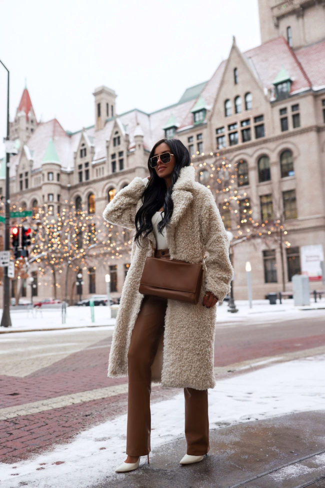 fashion blogger wearing tan leather pants from abercrombie