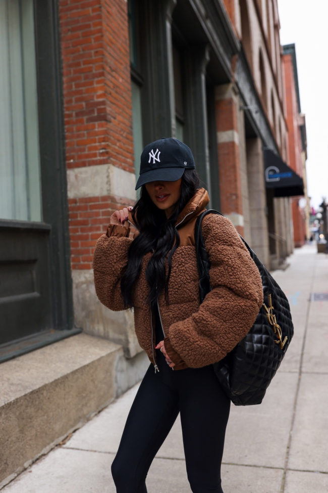 fashion blogger mia mia mine wearing a sherpa puffer jacket by abercrombie