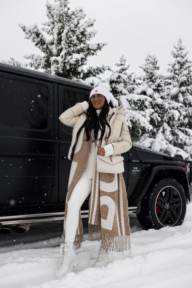 fashion blogger mia mia mine wearing a sam puffer jacket from saks